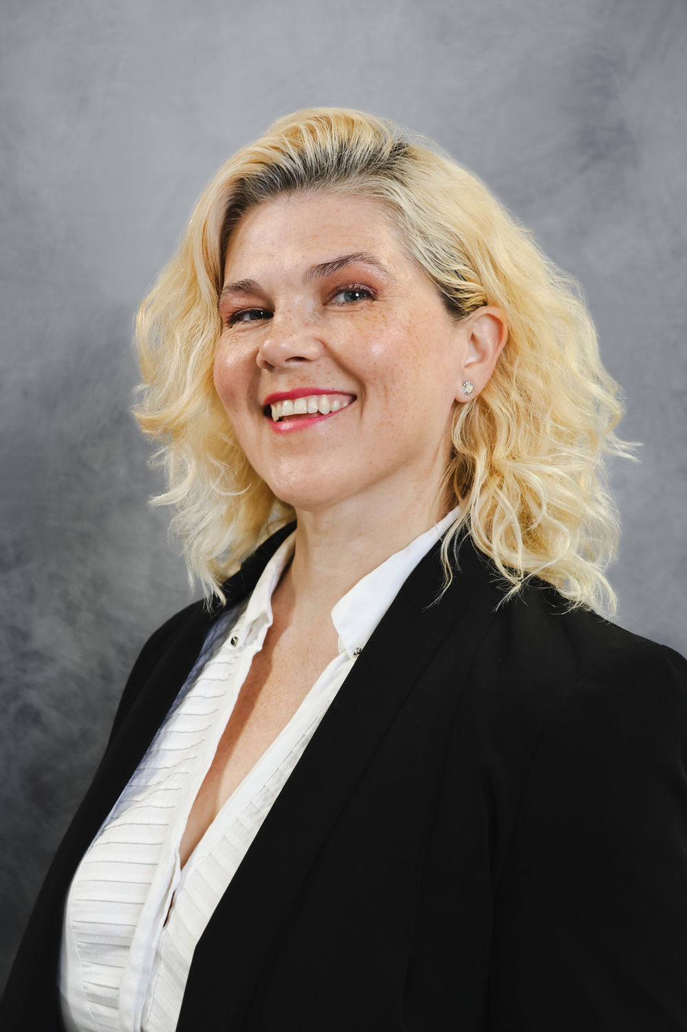 Business headshot photographed against a light backdrop at the Ceeb Moz studio in London.