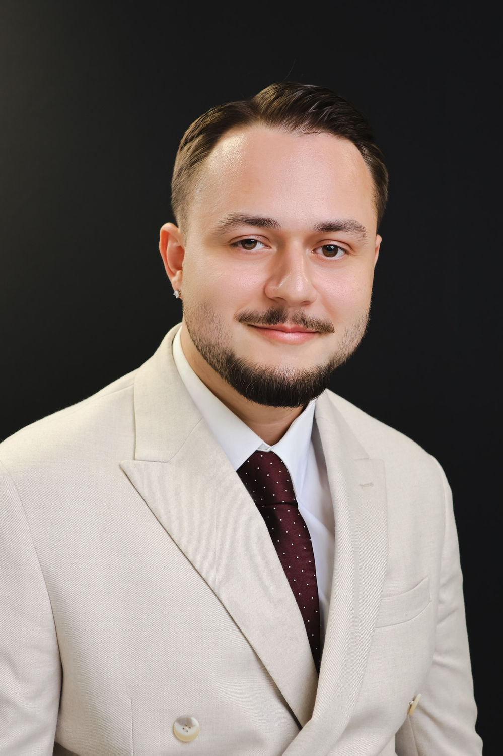 Professional headshot suited to CVs and company profiles, photographed in central London.