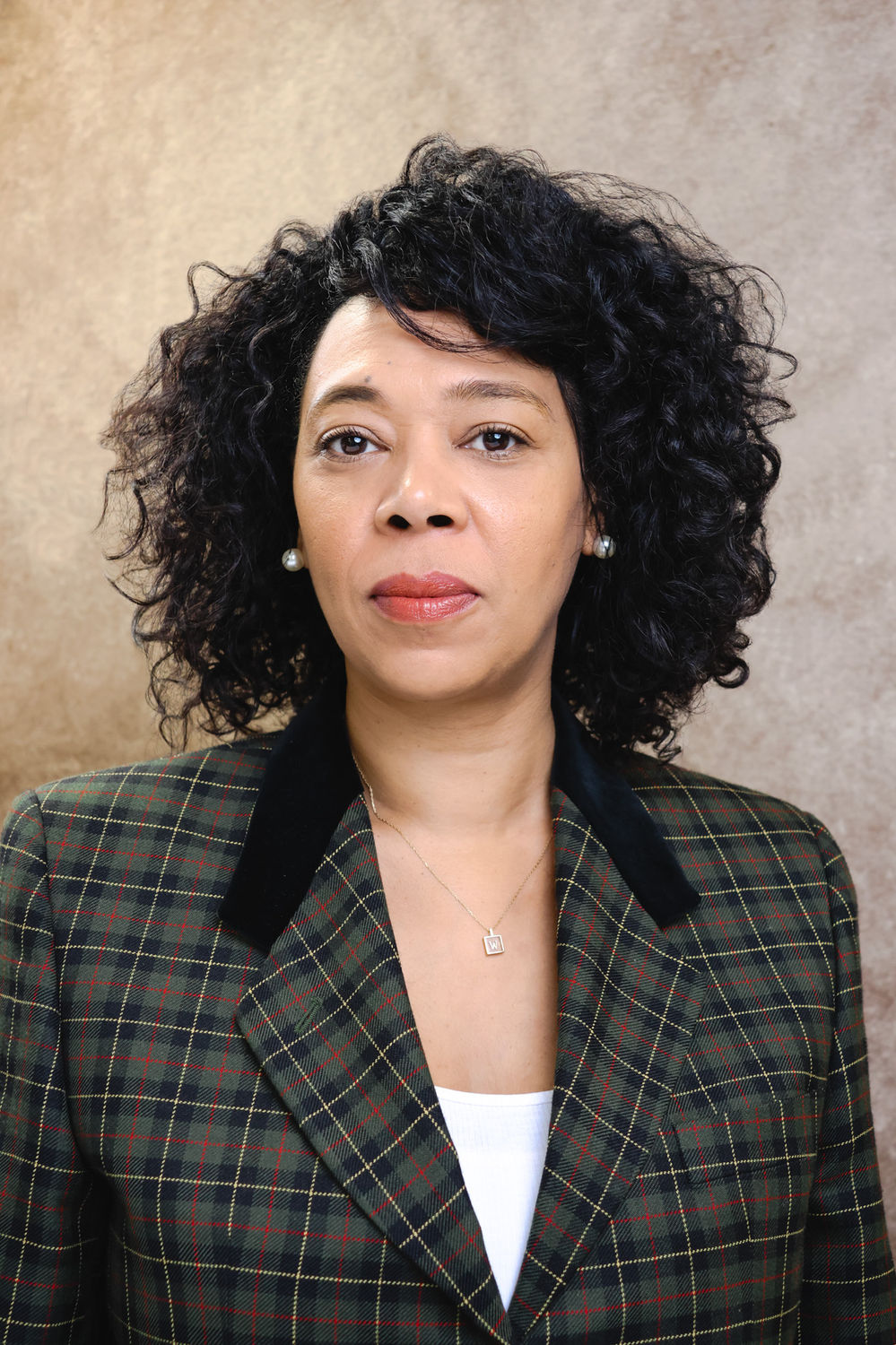 Corporate headshot photographed against a neutral backdrop at a King's Cross London studio.