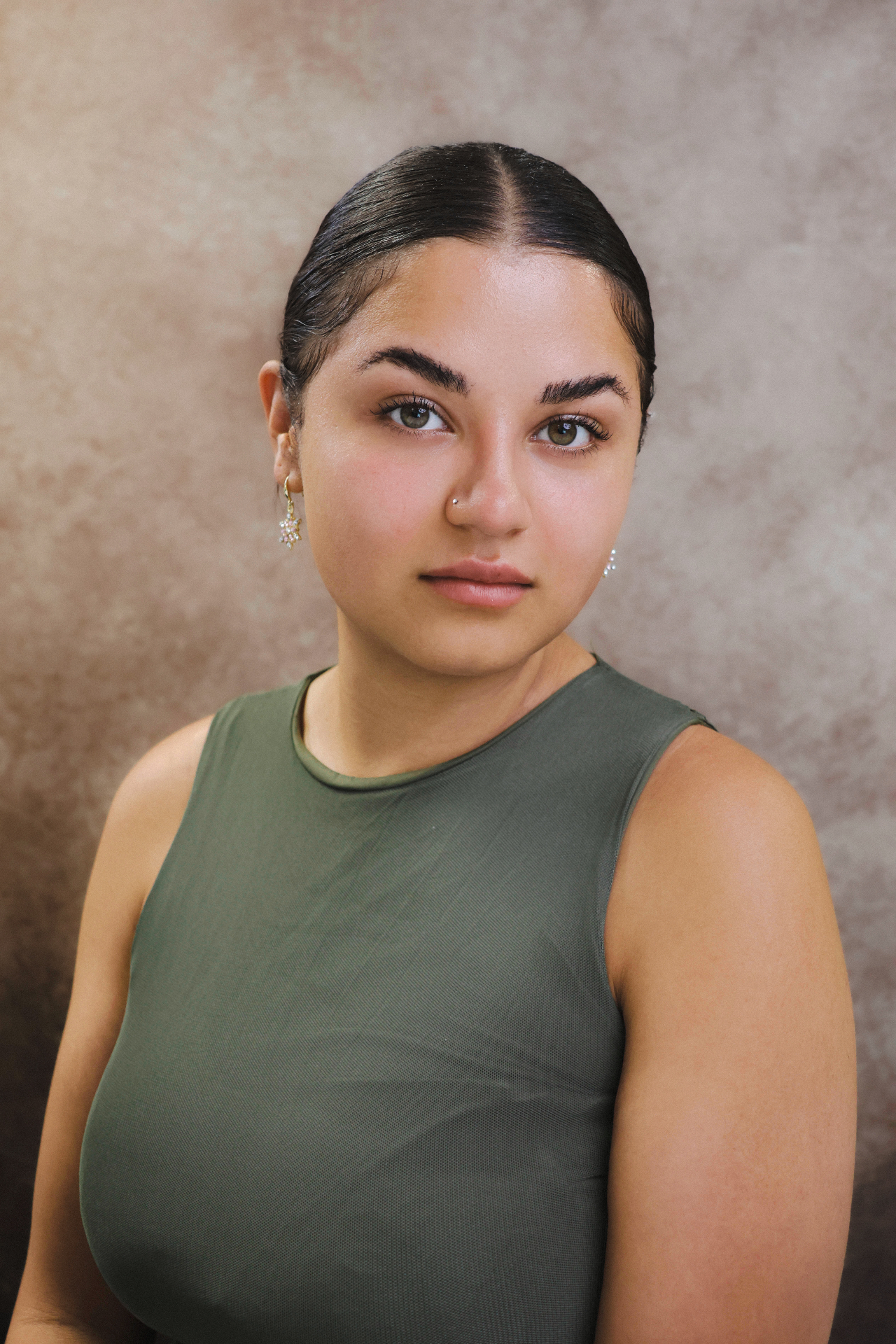 Natural professional portrait with textured backdrop
